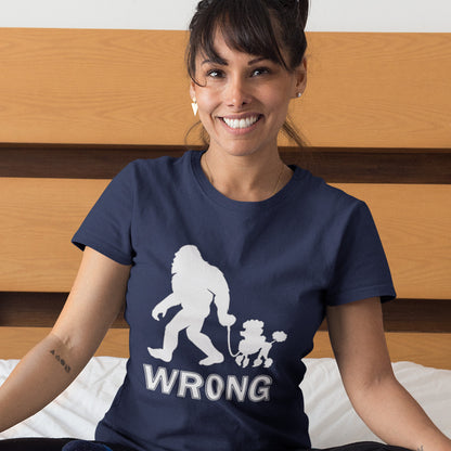 Woman wearing a French navy blue t-shirt with a graphic design and the word 'WRONG' sitting on a wooden floor. A funny Bigfoot t-shirt questioning the limits of acceptability. A poodle will never be the dog of choice for the Bigfoot. However open minded you are there are some things that will never look right. Made from 100% organic ring-spun cotton, this bigfoot t-shirt is unisex, high-quality, super comfy, and best of all, eco-friendly.