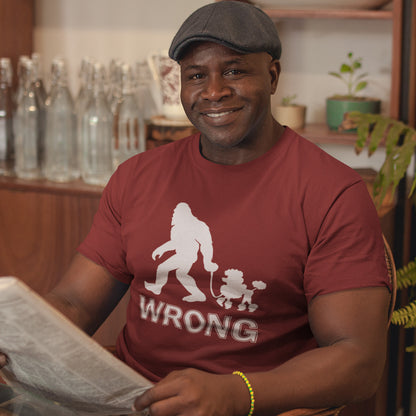 Man wearing a burgundy t-shirt with a graphic and the word 'WRONG' while reading a newspaper. A funny Bigfoot t-shirt questioning the limits of acceptability. A poodle will never be the dog of choice for the Bigfoot. However open minded you are there are some things that will never look right. Made from 100% organic ring-spun cotton, this funny bigfoot t shirt is unisex, high-quality, super comfy, and best of all, eco-friendly.