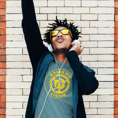 Man wearing sunglasses and a graphic t-shirt against a brick wall. A non conformist t shirt in the form of a road sign reminder that it's possibly not been the best idea to build our society around money. Wrong direction, change the system ! Made from 100% organic ring-spun cotton, this social awareness t shirt is unisex, high-quality, super comfy, and best of all, eco-friendly. A great choice for an anti capitalist socio economic demonstration.