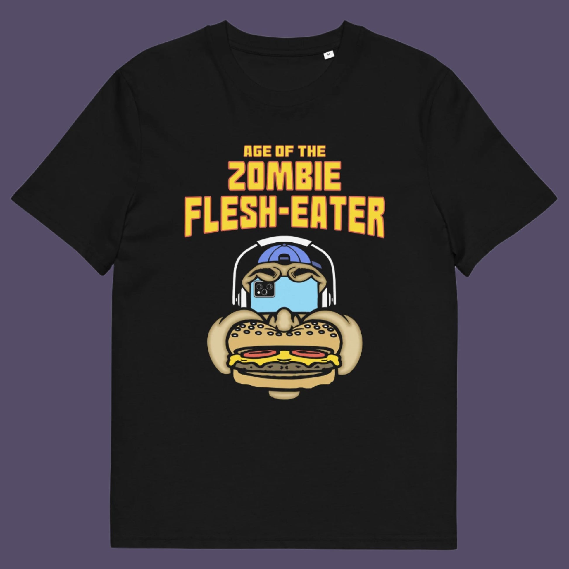 Black t-shirt. This funny vegetarian t-shirt design plays on the interpretation of a late 70's B rate movie. As a modern day vegan surrounded by people hypnotised on their mobile phone while eating meat based fast food, you may be forgiven for thinking you are living in the age of the zombie flesh-eater. Made from 100% organic ring-spun cotton, this meat free t shirt design is unisex, high-quality, super comfy, and best of all, eco-friendly.