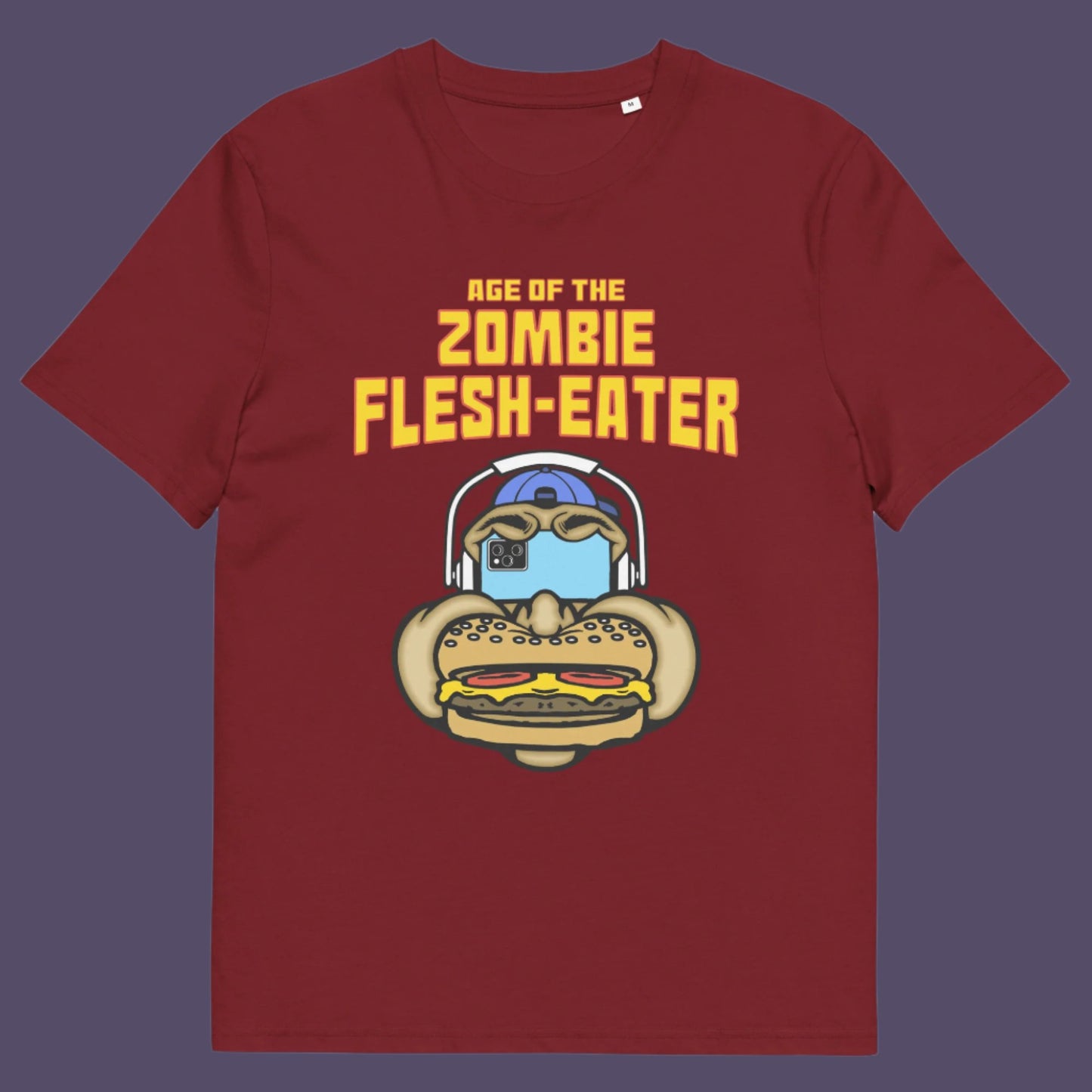 Burgundy t shirt. This funny vegetarian t-shirt design plays on the interpretation of a late 70's B rate movie. As a modern day vegan surrounded by people hypnotised on their mobile phone while eating meat based fast food, you may be forgiven for thinking you are living in the age of the zombie flesh-eater. Made from 100% organic ring-spun cotton, this meat free t shirt design is unisex, high-quality, super comfy, and best of all, eco-friendly.
