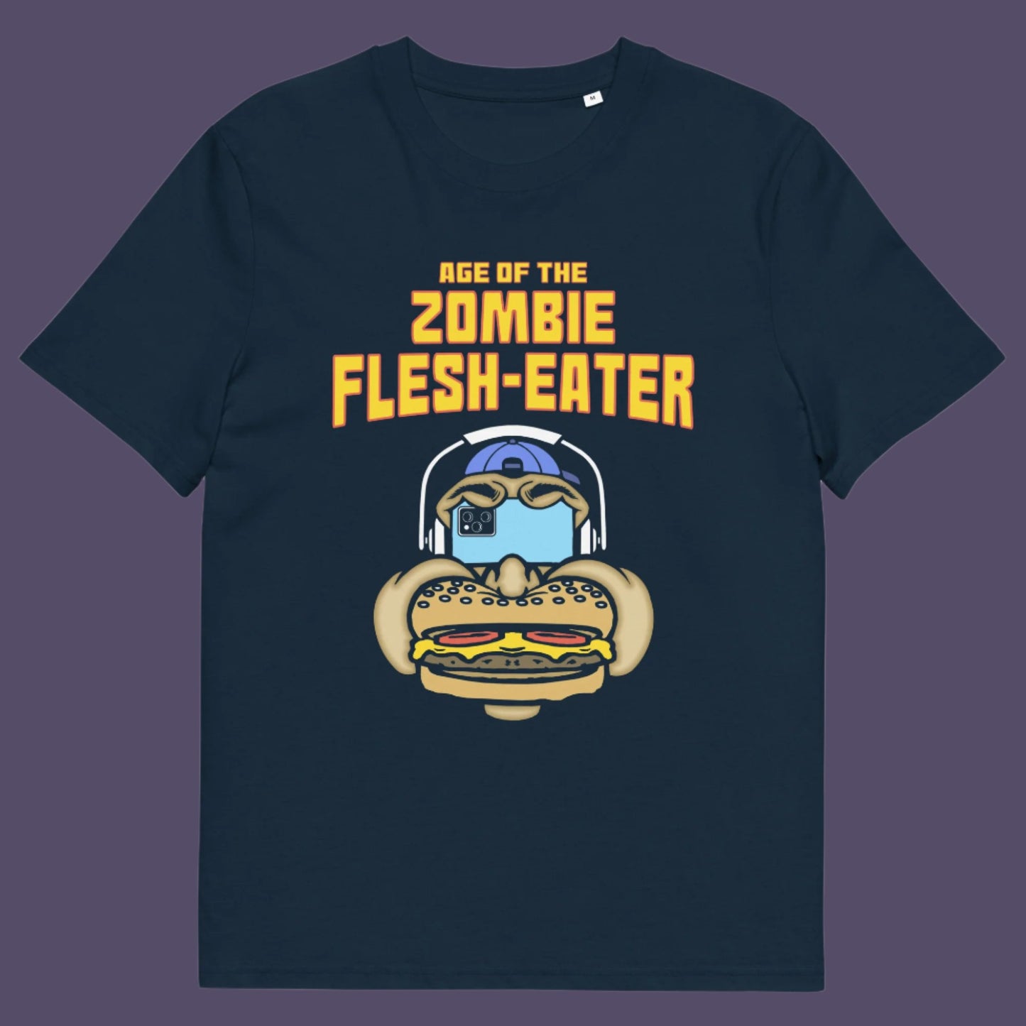 French navy t-shirt. This funny vegetarian t-shirt design plays on the interpretation of a late 70's B rate movie. As a modern day vegan surrounded by people hypnotised on their mobile phone while eating meat based fast food, you may be forgiven for thinking you are living in the age of the zombie flesh-eater. Made from 100% organic ring-spun cotton, this meat free t shirt design is unisex, high-quality, super comfy, and best of all, eco-friendly.