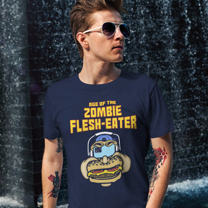 Man wearing a French navy blue t-shirt  standing against a dark textured wall. This meat free t-shirt design plays on the interpretation of a late 70's B rate movie. As a modern day vegan surrounded by people hypnotised on their mobile phone while eating meat based fast food, you may be forgiven for thinking you are living in the age of the zombie flesh-eater. Made from 100% organic ring-spun cotton, this meat free t shirt design is unisex, high-quality, super comfy, and best of all, eco-friendly.