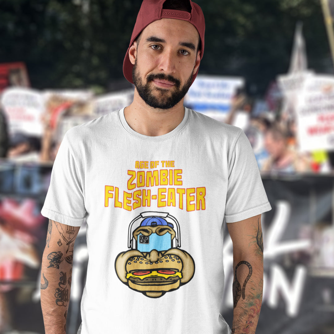 A man wearing a white t-shirt. This funny plant based t shirt design plays on the interpretation of a late 70's B rate movie. As a modern day vegan or vegetarian surrounded by people hypnotised on their mobile phone while eating meat based fast food, you may be forgiven for thinking you are living in the age of the zombie flesh-eater. Made from 100% organic ring-spun cotton, this meat free t shirt design is unisex, high-quality, super comfy, and best of all, eco-friendly.