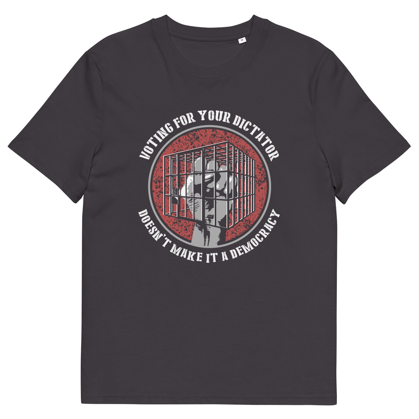 An anthracite short-sleeve t-shirt with a circular graphic on the chest. The graphic features a red distressed background with a white silhouette of a person behind bars, surrounded by the text 'VOTING FOR YOUR DICTATOR' on top and 'DON'T MAKE IT A DEMOCRACY' on the bottom.