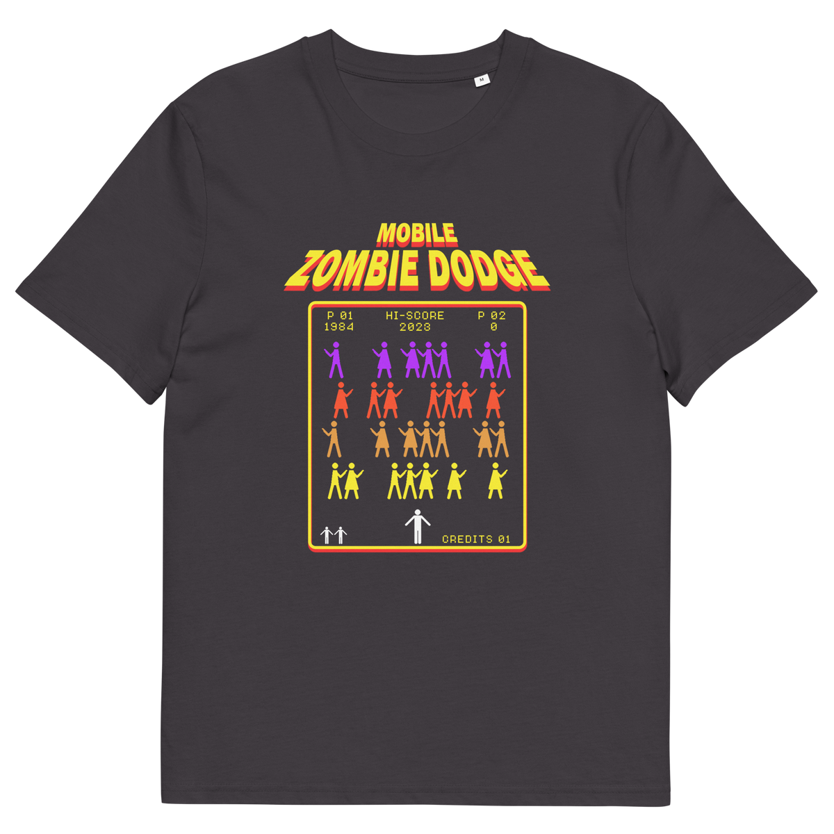 An anthracite grey t-shirt featuring a retro video game style graphic on the chest. The graphic displays the text 'MOBILE ZOMBIE DODGE' in a yellow-orange gradient font above a grid of dancing zombie figures in purple, red, and yellow, mimicking a classic arcade game menu.