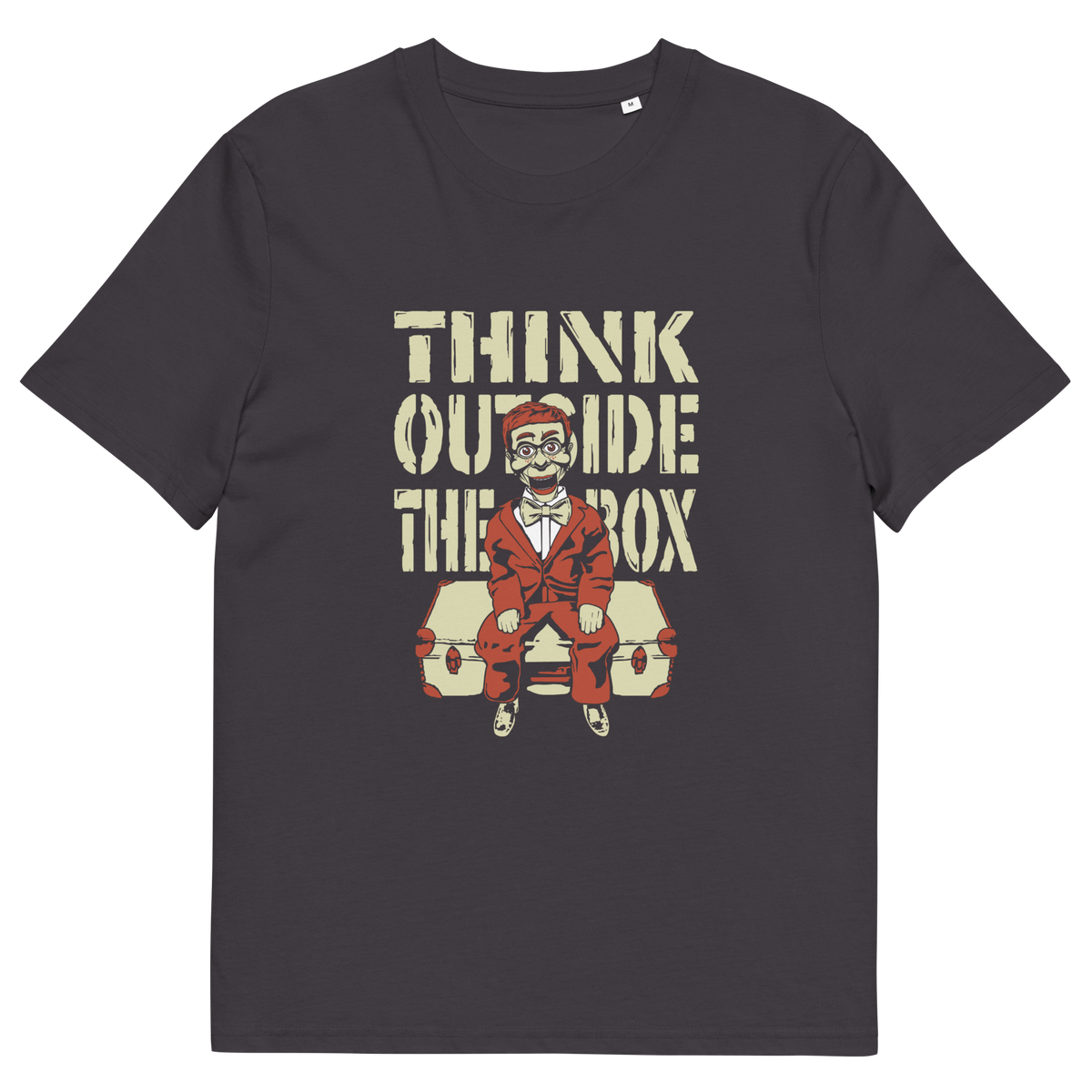 An anthracite grey  t-shirt featuring a graphic print on the front. The graphic displays the text 'THINK OUTSIDE THE BOX' in a distressed beige font above an illustration of a ventriloquist dummy.
