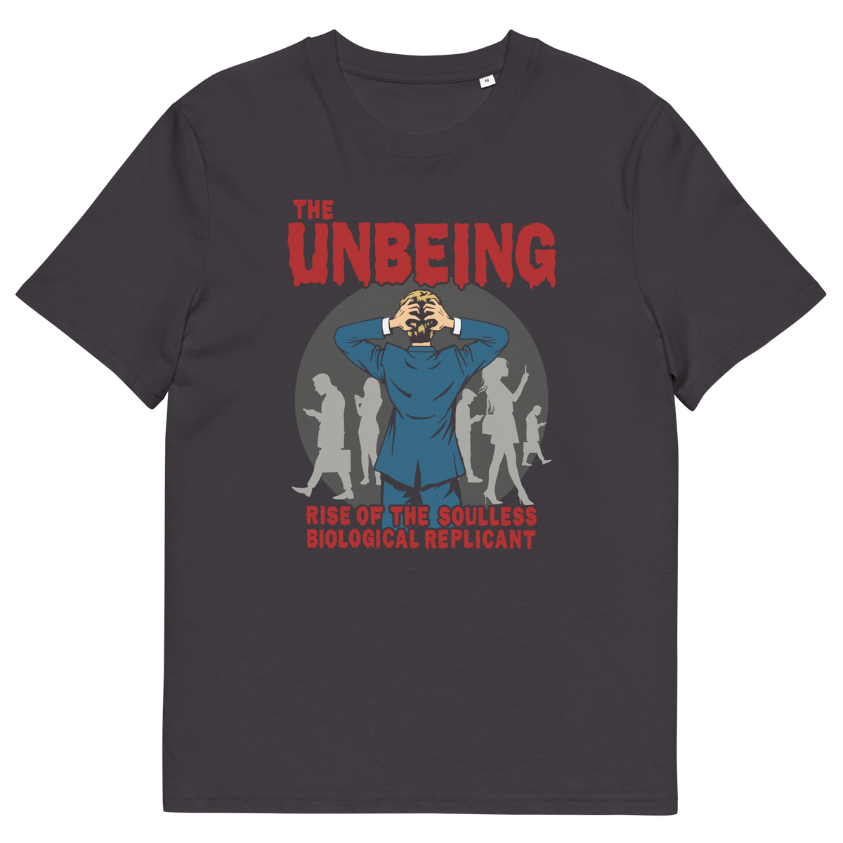 An anthracite grey short sleeved crew neck t-shirt with a pop art graphic of a man with his hands on his head while looking at a group of people engrossed with their smartphones. Above is the text "THE UNBEING" and underneath is the text "RISE OF THE SOULLESS BIOLOGICAL REPLICANT".