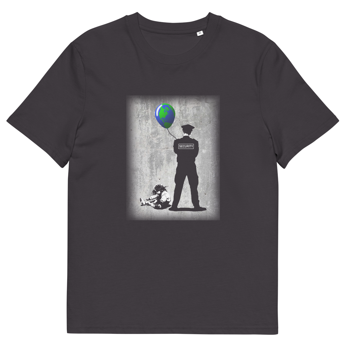 An anthracite grey short sleeved crew neck t-shirt with a graffiti stencil design of a girl sitting on the floor, tying her shoelace while a security guard looks after her globe balloon. 