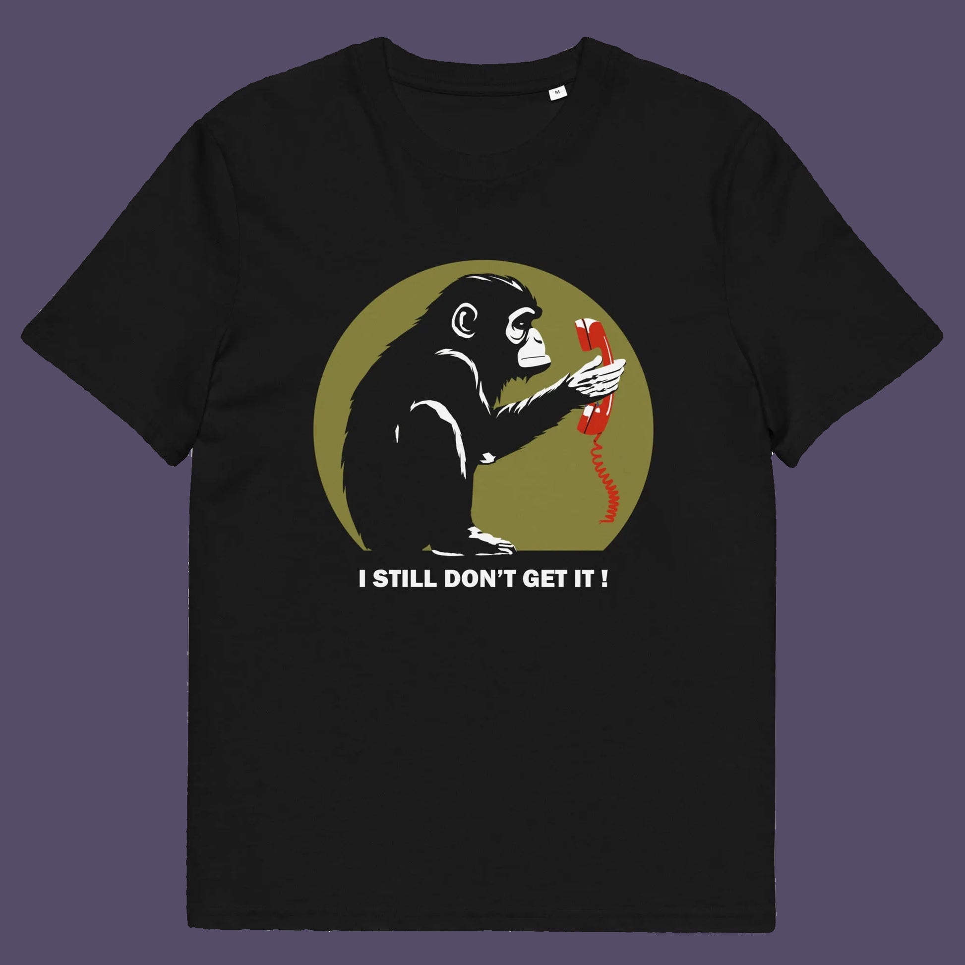 Black t shirt. This anti smart phone abuse t-shirt design highlights the human obsession with smart phones and how strange it must look to an ape. An outsiders view of a world glued to mobile phones. Made from 100% organic ring-spun cotton, this anti mobile phone abuse t-shirt is unisex, high-quality, super comfy, and best of all, eco-friendly.