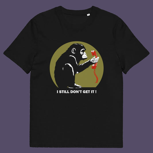 Black t shirt. This anti smart phone abuse t-shirt design highlights the human obsession with smart phones and how strange it must look to an ape. An outsiders view of a world glued to mobile phones. Made from 100% organic ring-spun cotton, this anti mobile phone abuse t-shirt is unisex, high-quality, super comfy, and best of all, eco-friendly.