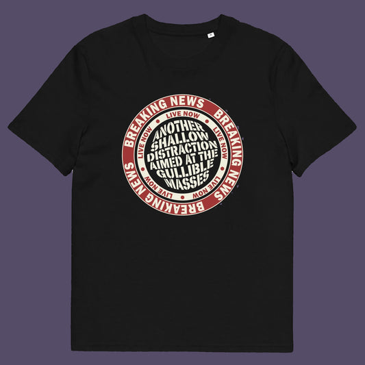 Black t shirt. An anti media, non conformist t shirt. This design suggests that the media is being used to keep us distracted from the real issues taking place around us. Don't fall for the new bright flashing lights! Made from 100% organic ring-spun cotton, this social awareness t shirt is unisex, high-quality, super comfy, and best of all, eco-friendly.