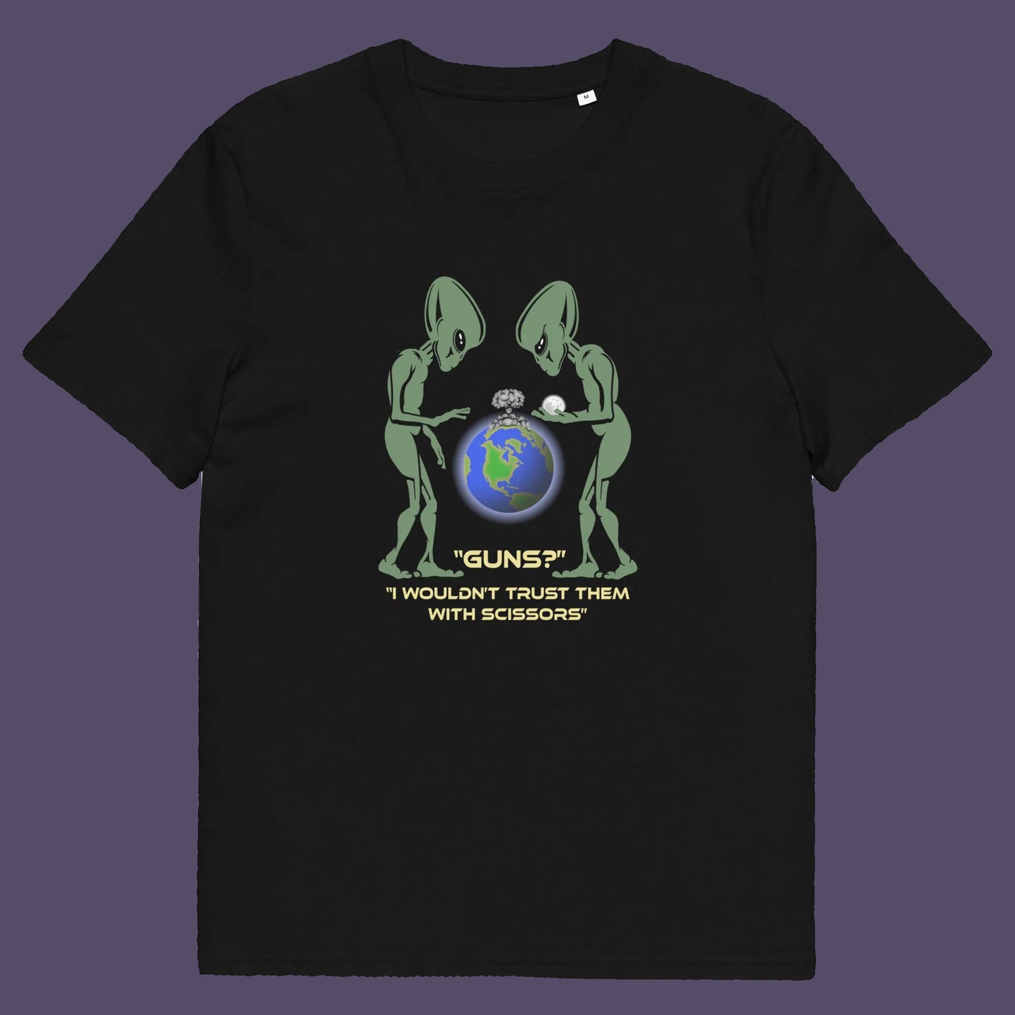 Black t shirt. This funny alien t shirt highlights our over use of weaponry. With our lust for guns we must look out of control from an alien view point. No wonder they don't openly reveal themselves to us. Made from 100% organic ring-spun cotton, this counter culture t shirt is unisex, high-quality, super comfy, and best of all, eco-friendly.