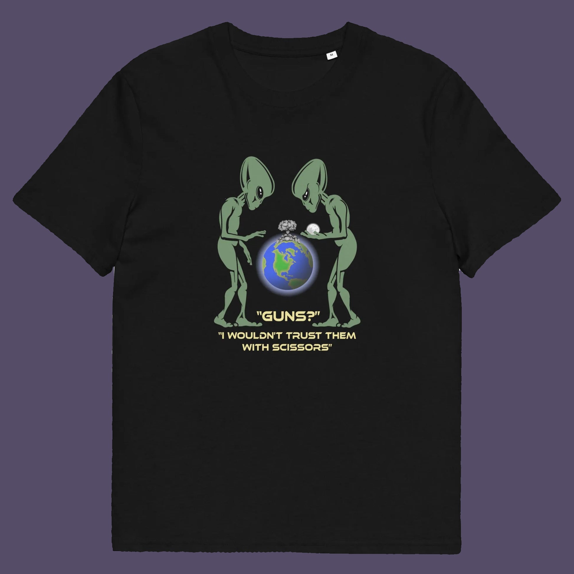 Black t shirt. This funny alien t shirt highlights our over use of weaponry. With our lust for guns we must look out of control from an alien view point. No wonder they don't openly reveal themselves to us. Made from 100% organic ring-spun cotton, this counter culture t shirt is unisex, high-quality, super comfy, and best of all, eco-friendly.