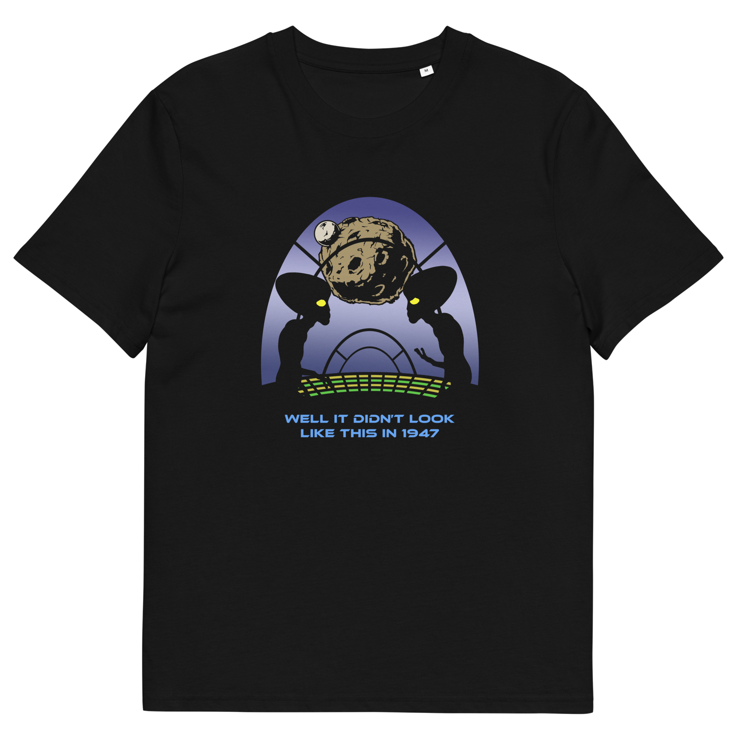 A black short-sleeve crewneck t-shirt featuring a retro sci-fi graphic of two alien silhouettes looking at a planet, with the text 'WELL IT DIDN'T LOOK LIKE THIS IN 1947' printed below.