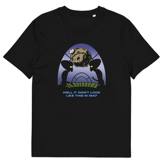 A black short-sleeve crewneck t-shirt featuring a retro sci-fi graphic of two alien silhouettes looking at a planet, with the text 'WELL IT DIDN'T LOOK LIKE THIS IN 1947' printed below.