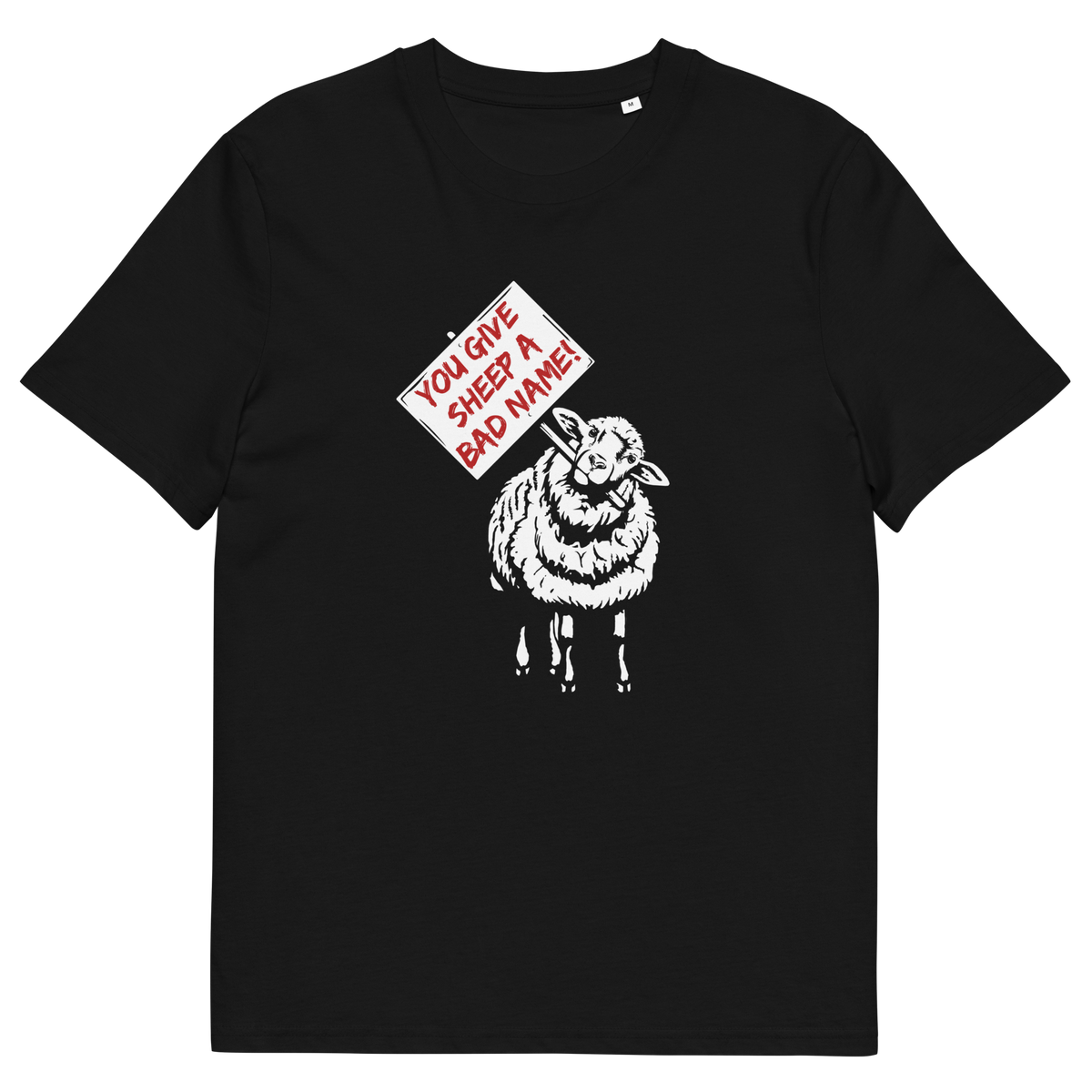 A black short-sleeve crewneck t-shirt featuring a graphic print of a white sheep holding a red and white sign that reads 'YOU GIVE SHEEP A BAD NAME!'.