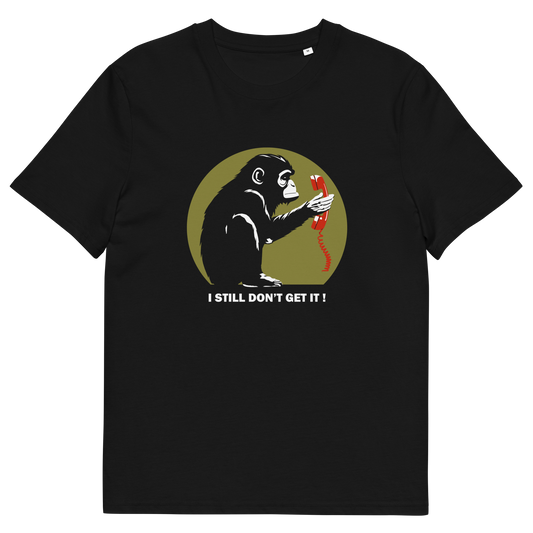 Black t-shirt with a design of a monkey staring at an old style telephone receiver with text underneath saying "I STILL DON'T GET IT".