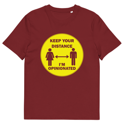 A burgundy short sleeved crew neck t-shirt. A yellow circle graphic including a male and female symbol with the text "KEEP YOUR DISTANCE, I'M OPINIONATED" .