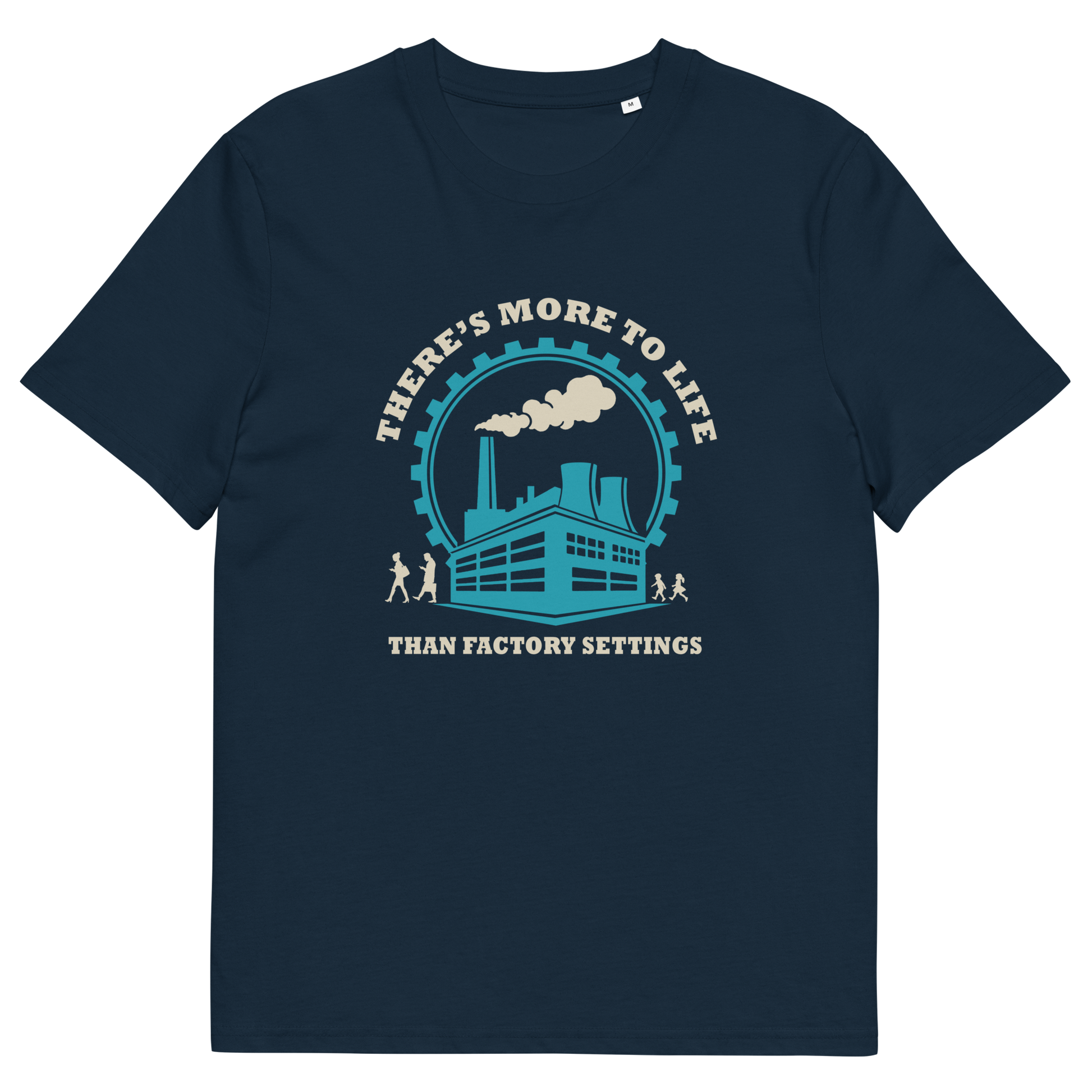 A French navy blue short-sleeve crewneck t-shirt with a graphic print on the front. The graphic features a light blue and cream illustration of an industrial factory building under a circular gear and the text 'THERE'S MORE TO LIFE THAN FACTORY SETTINGS'.