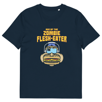 A French navy blue short-sleeve t-shirt with a graphic on the front. The graphic features the text 'AGE OF THE ZOMBIE FLESH-EATER' in yellow, above a cartoon zombie head wearing headphones and biting a burger.