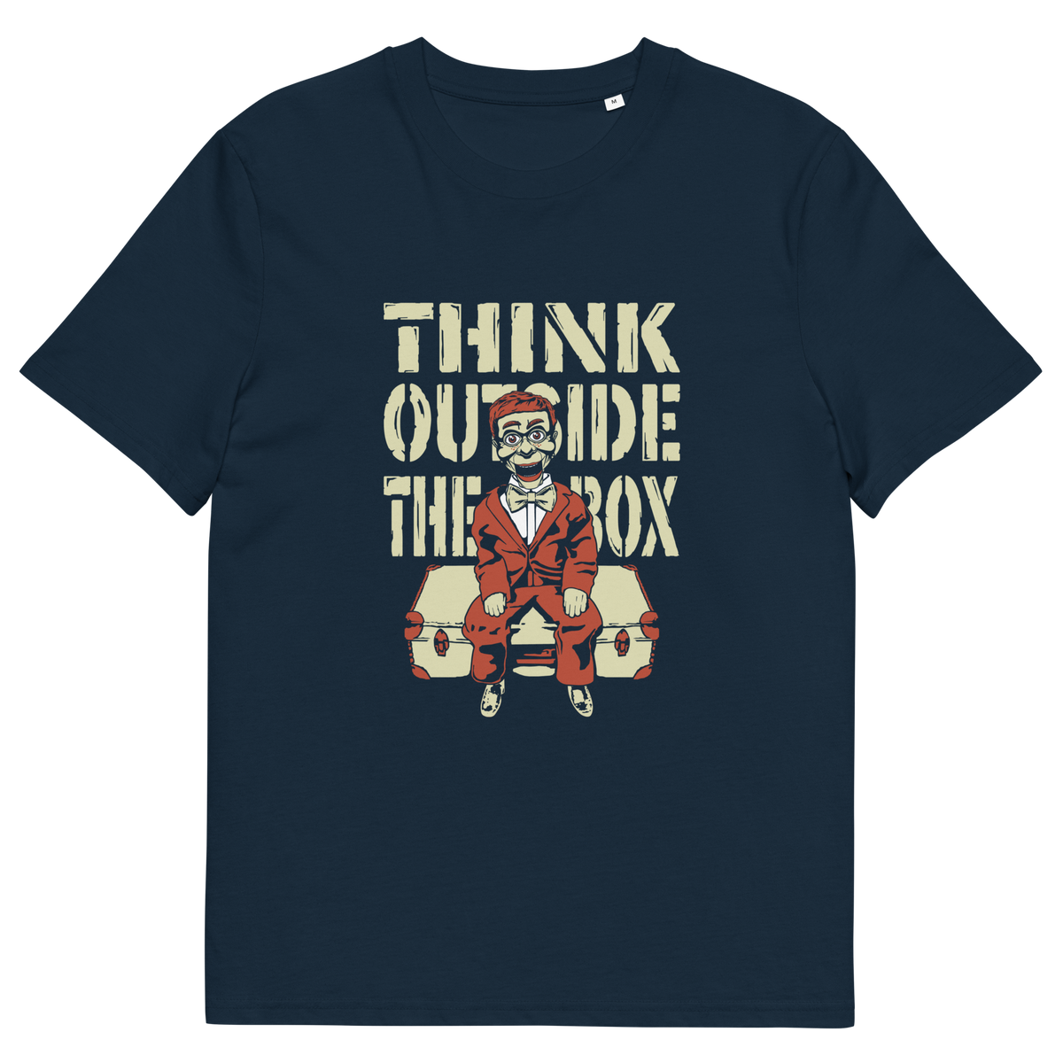 A French navy blue short-sleeve  t-shirt featuring a graphic print on the front. The graphic displays the text 'THINK OUTSIDE THE BOX' in a distressed beige font above an illustration of a ventriloquist dummy.