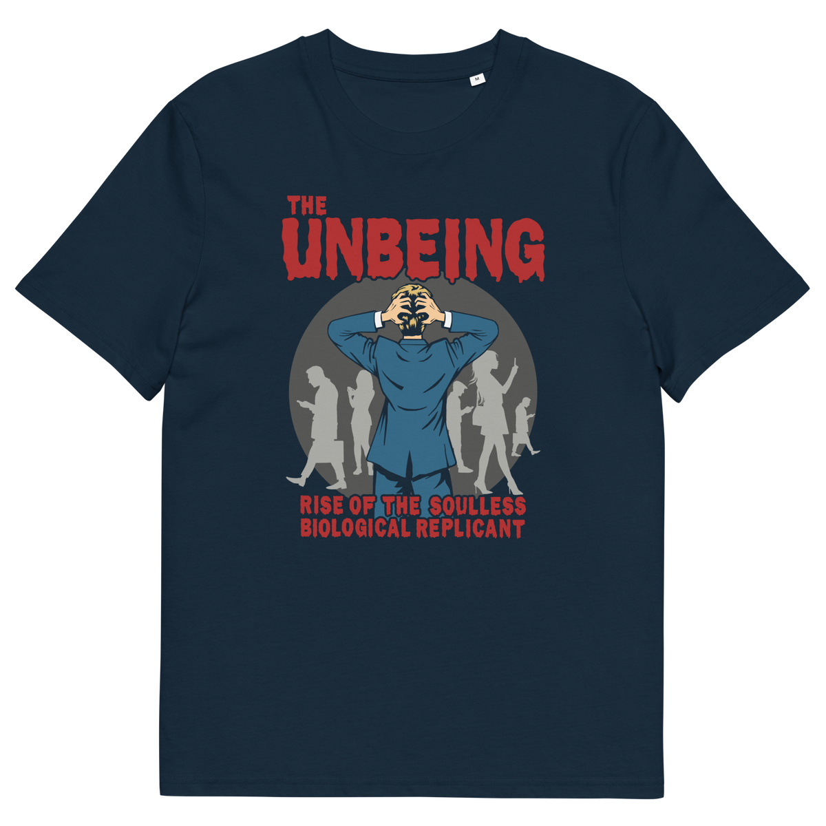 A French navy blue short sleeved crew neck t-shirt with a pop art graphic of a man with his hands on his head while looking at a group of people engrossed with their smartphones. Above is the text "THE UNBEING" and underneath is the text "RISE OF THE SOULLESS BIOLOGICAL REPLICANT".