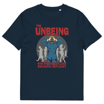 A French navy blue short sleeved crew neck t-shirt with a pop art graphic of a man with his hands on his head while looking at a group of people engrossed with their smartphones. Above is the text "THE UNBEING" and underneath is the text "RISE OF THE SOULLESS BIOLOGICAL REPLICANT".