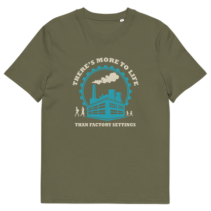 An khaki short-sleeve t-shirt with a graphic print on the front. The graphic features a light blue and cream illustration of a factory with smokestacks, surrounded by the text 'THERE'S MORE TO LIFE THAN FACTORY SETTINGS'.