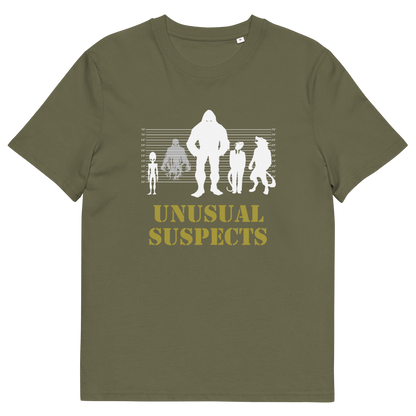 A khaki short-sleeve t-shirt with a white and yellow graphic on the front. The graphic features silhouettes of four figures in increasing sizes against a height line, with the text 'UNUSUAL SUSPECTS' printed below in yellow.