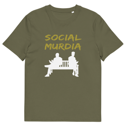 A khaki t-shirt with a graphic print on the front. The print features the words 'SOCIAL MURDIA' in a textured mustard yellow font above a white silhouette of two people sitting on a bench.
