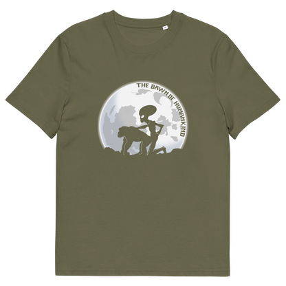 A khaki green, short sleeved, crew neck t-shirt with the silhouette of an alien and a monkey in front of the moon with the text "THE DAWN OF HUMANKIND".