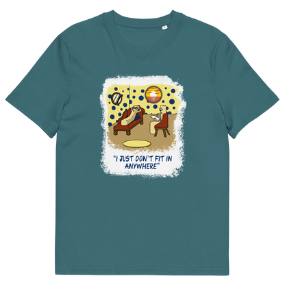 A stargazer blue short-sleeve t-shirt with a central graphic print. The graphic features a cartoon illustration of a person sitting on a lounge chair in a theorists room , with a white distressed border and the text 'I JUST DON'T FIT IN ANYWHERE' below.