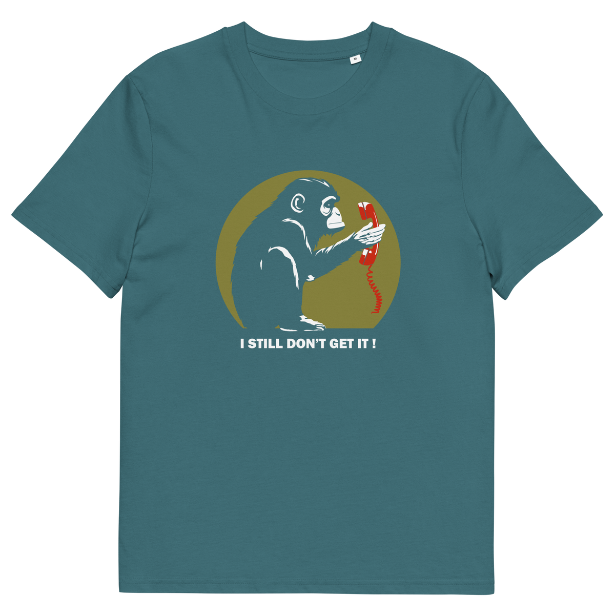 A stargazer blue t-shirt with a design of a monkey staring at an old style telephone receiver with text underneath saying "I STILL DON'T GET IT".