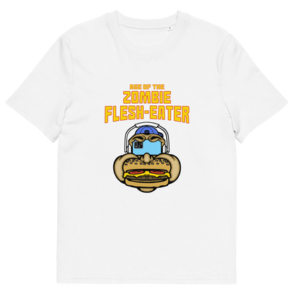 White t-shirt with a graphic on the front. The graphic features the text 'AGE OF THE ZOMBIE FLESH-EATER' in yellow, above a cartoon zombie head wearing headphones and biting a burger.