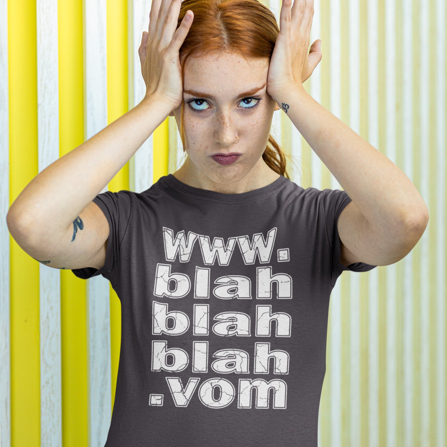 Woman wearing a t-shirt with 'www. blah blah blah. vom' text against a yellow and white striped background. A non conformist t shirt for those who are bored and sickened by how much of their world exists through the internet nowadays. Show how unimpressed you are with this nonconformist t-shirt design. Made from 100% organic ring-spun cotton, this social awareness t shirt is unisex, high-quality, super comfy, and best of all, eco-friendly.
